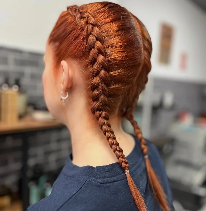Trenzas cobrizas pulidas realizadas por Rolling Peluqueros en Getafe